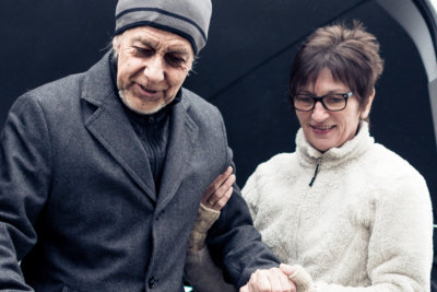 Nurse Helping Elderly Man Exit A Van