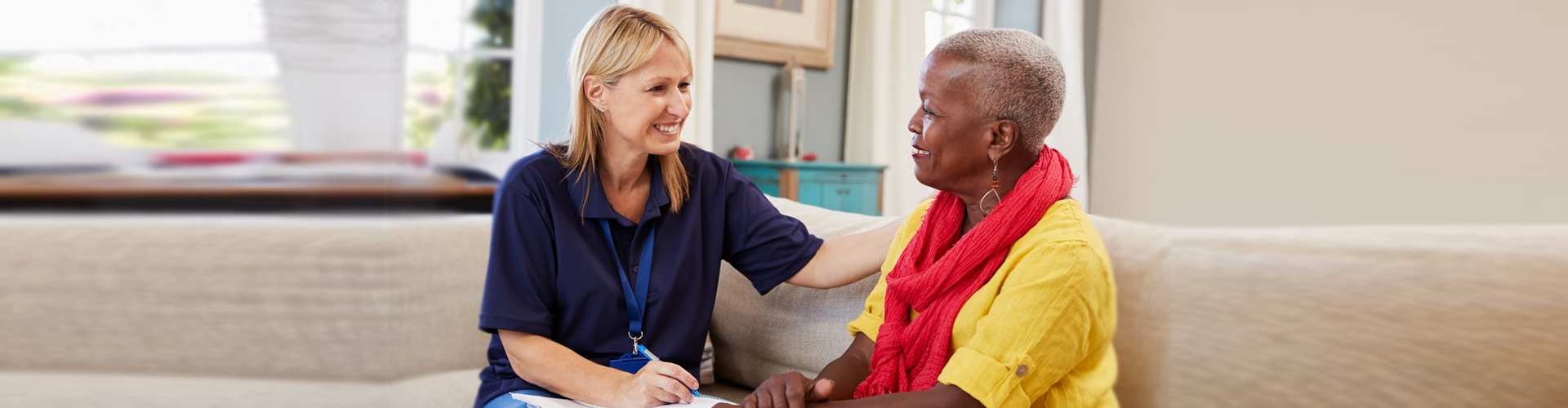 old woman and nurse talking